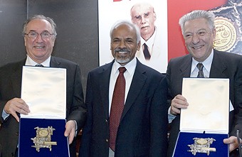John Iliopoulos and Luciano Maiani